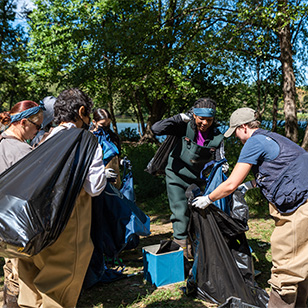 Several Women In Natural Sciences students take part in a cleanup.